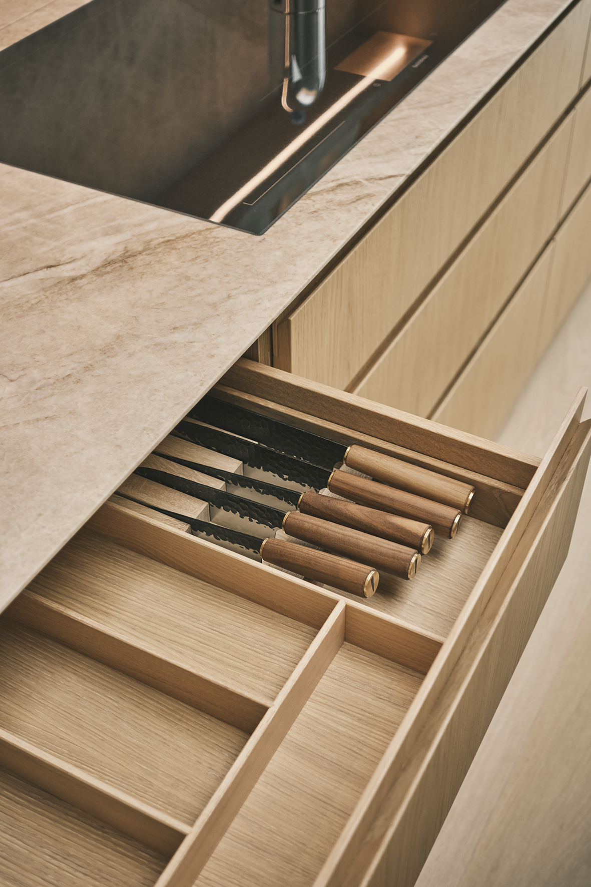Bespoke kitchen by Lanserring featuring solid oak for the drawer boxes and internals.